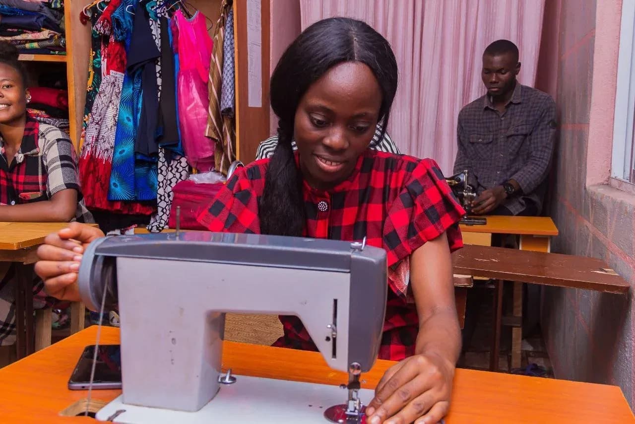 A trainee at a sewing machine in GAMAID vocational training