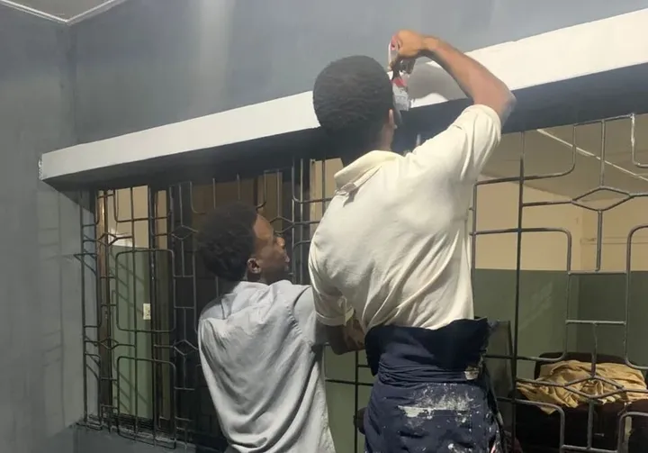 Trainees painting during GAMAID vocational training
